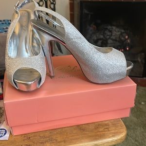 Sparkly silver de blossom collection shoes. Worn once. Marks on bottom of shoes.